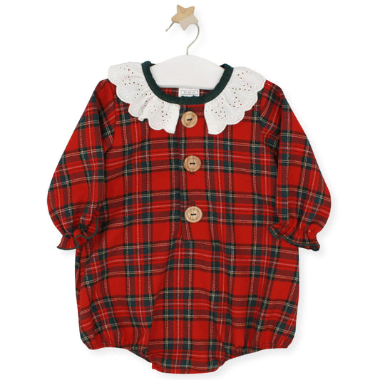 Red tartan baby romper with large white broderie collar and wooden front buttons, by Rapife, displayed on hanger with star hook.