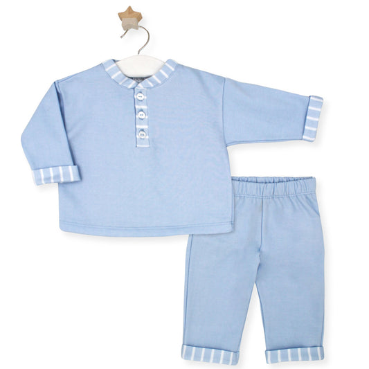 Baby blue two-piece cotton outfit by Rapife with striped trim on cuffs, collar, and trousers, displayed on a hanger with wooden star hook.