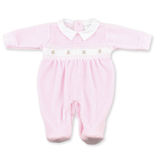 Pink baby romper with white collar on a white background