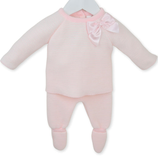 Pink baby outfit with a bow on a white background