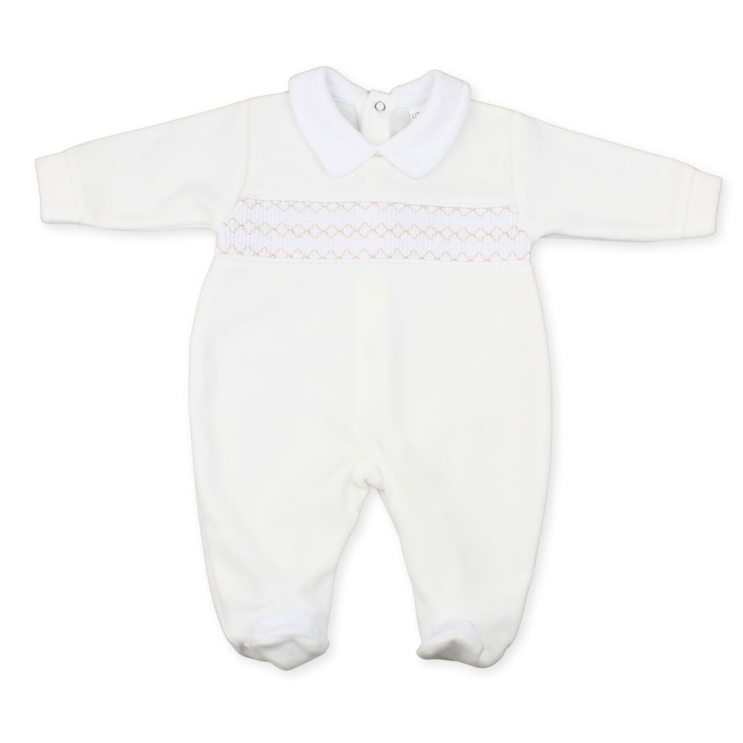 White baby romper with smocked details on a white background