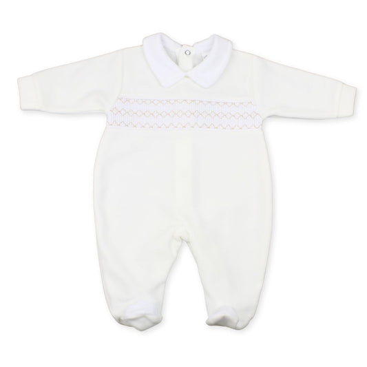 White baby romper with smocked details on a white background