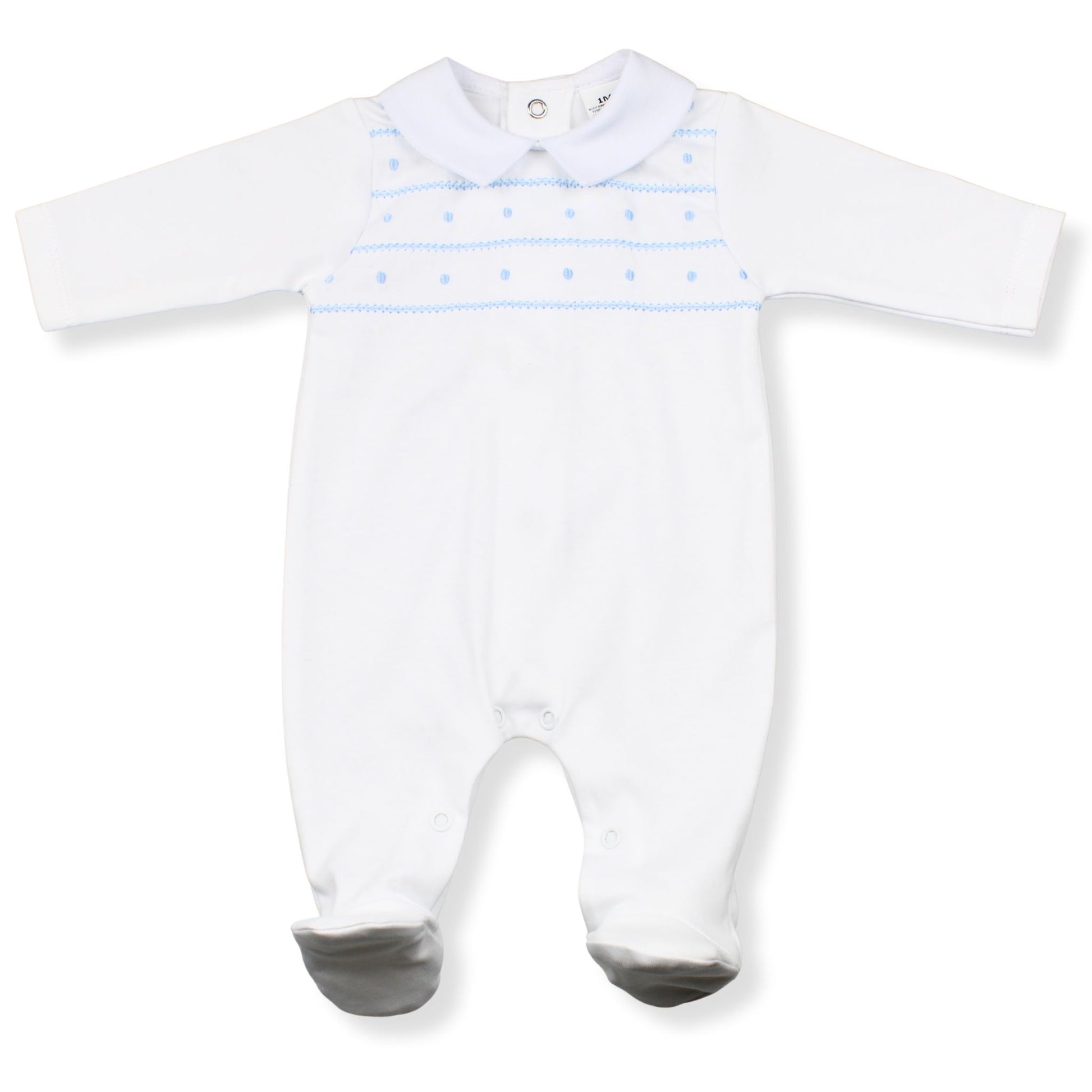 White baby onesie with blue patterns on a white background