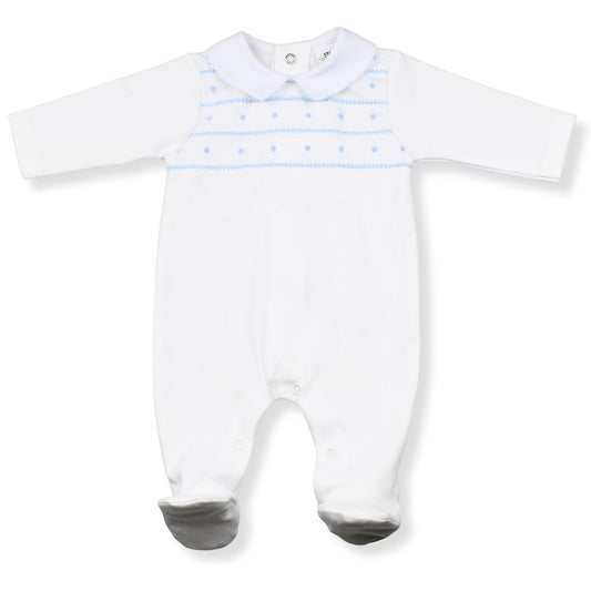 White baby onesie with blue patterns on a white background