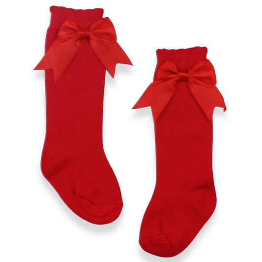 Red socks with large bows on a white background
