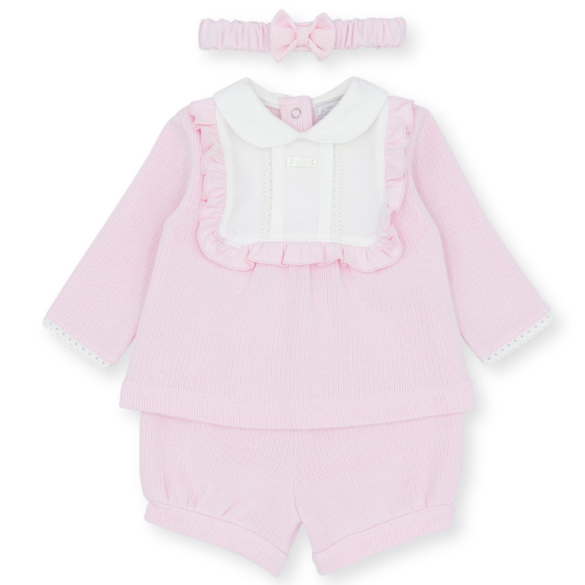 Pink baby outfit with ruffled details and matching headband on a white background