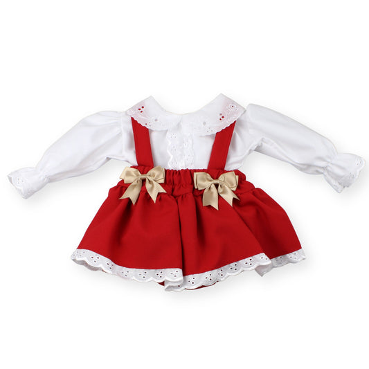 Red dress with white blouse and braces on a white background