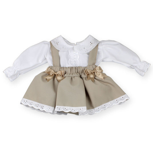 babys's dress with white blouse and beige skirt on a white background