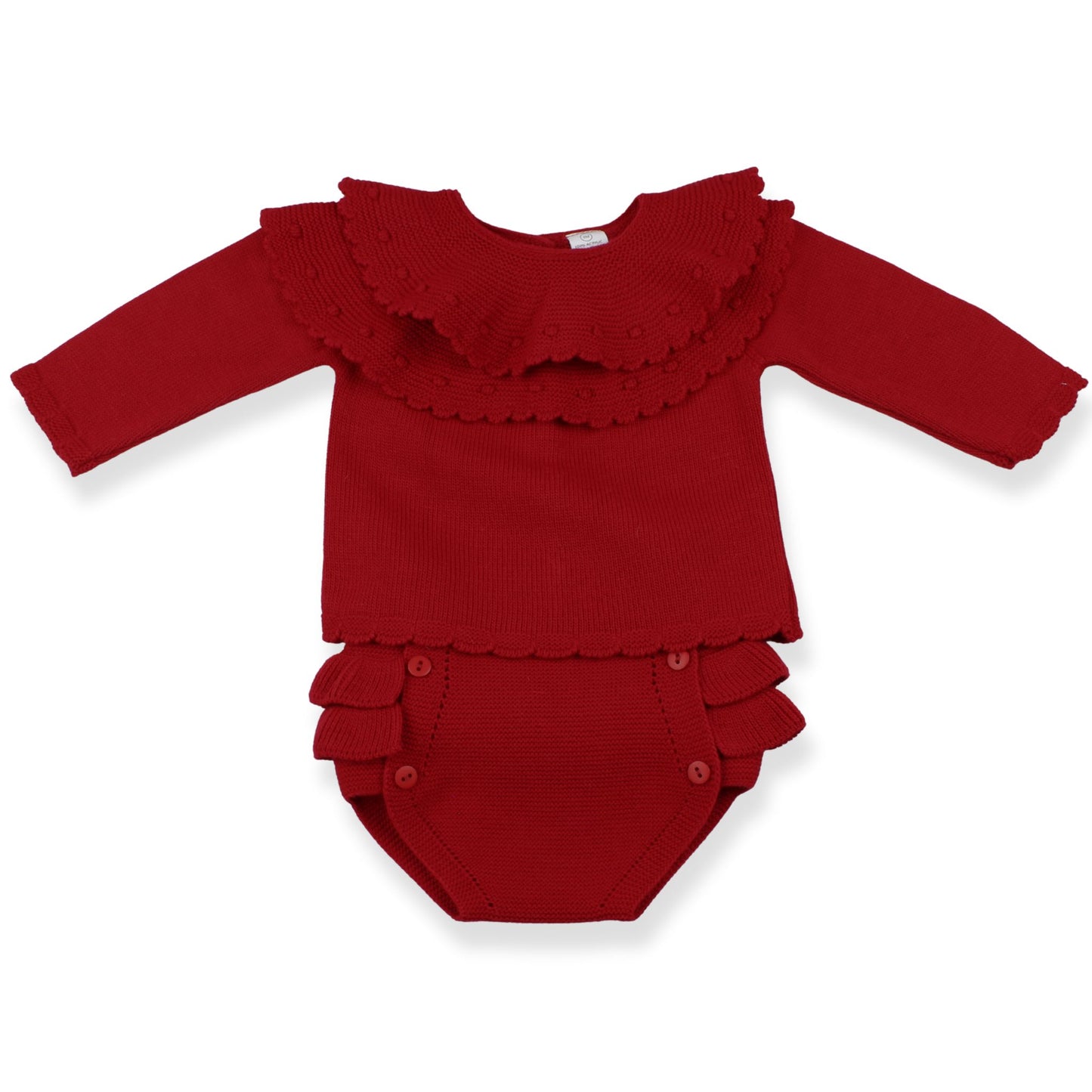 Red baby outfit with ruffled details on a white background