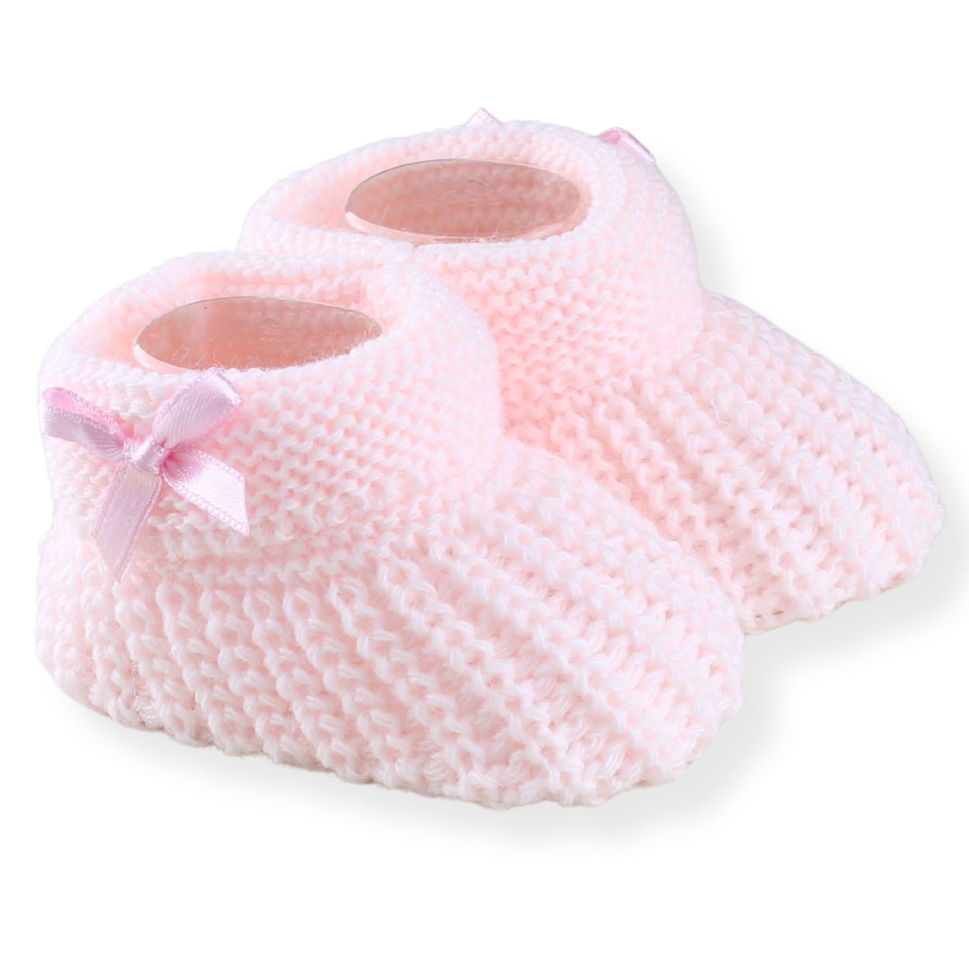 Pink baby booties with a bow on a white background