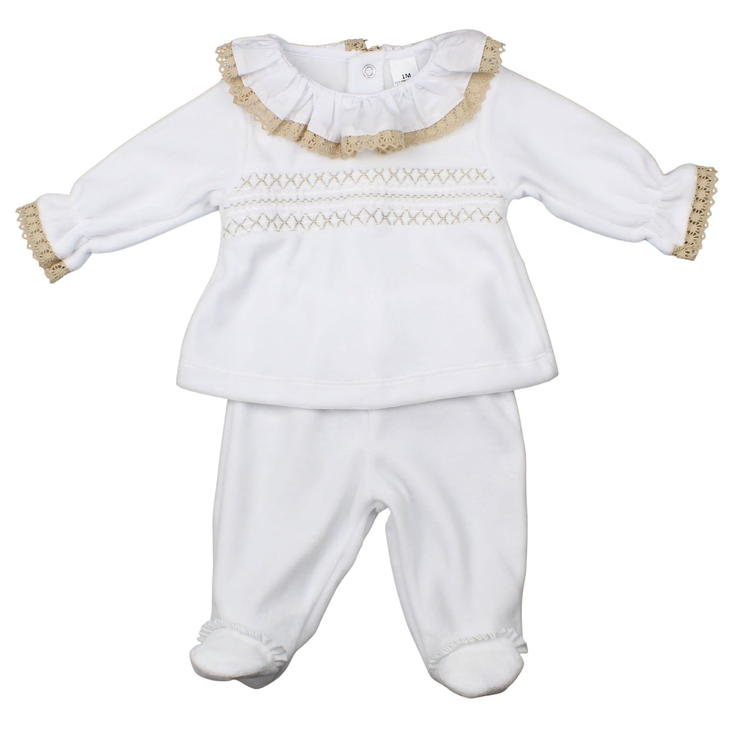 White baby outfit with ruffled collar and gold trim on a white background