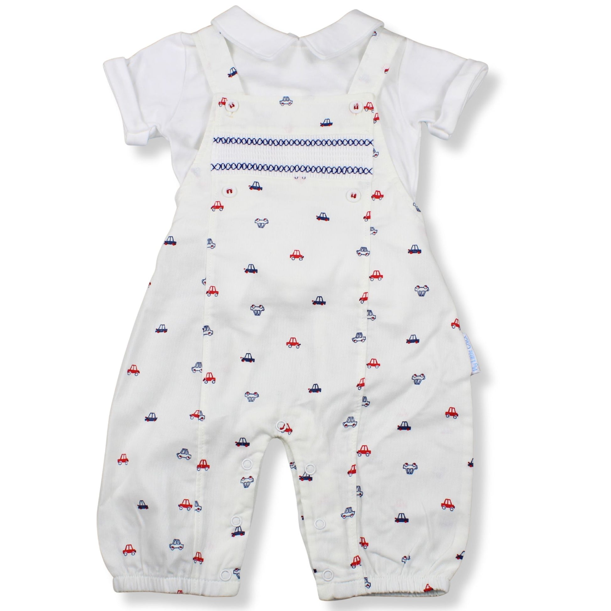 Baby outfit with white shirt and overalls featuring car pattern on a white background