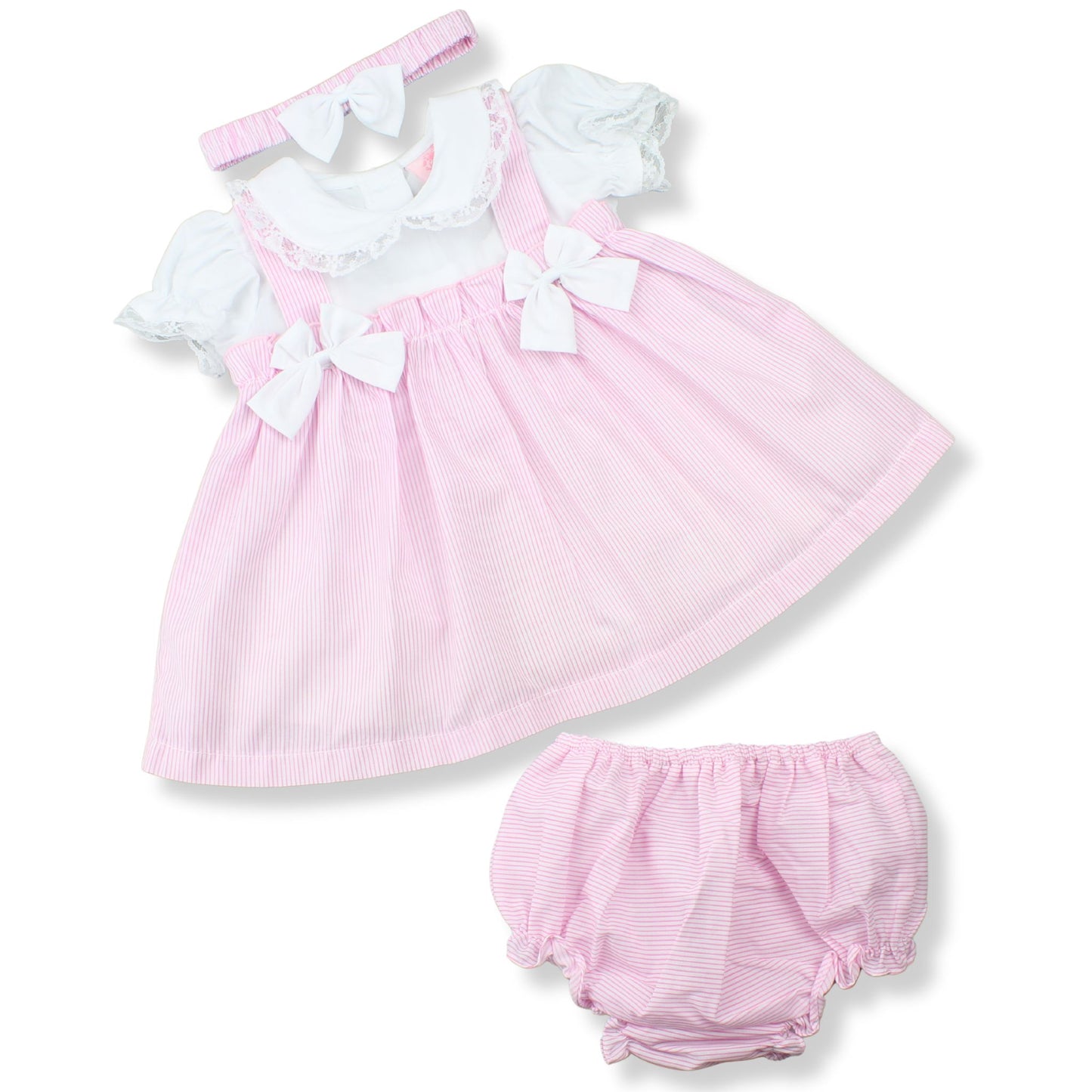 Pink baby dress with white ruffles and matching bloomers on a white background