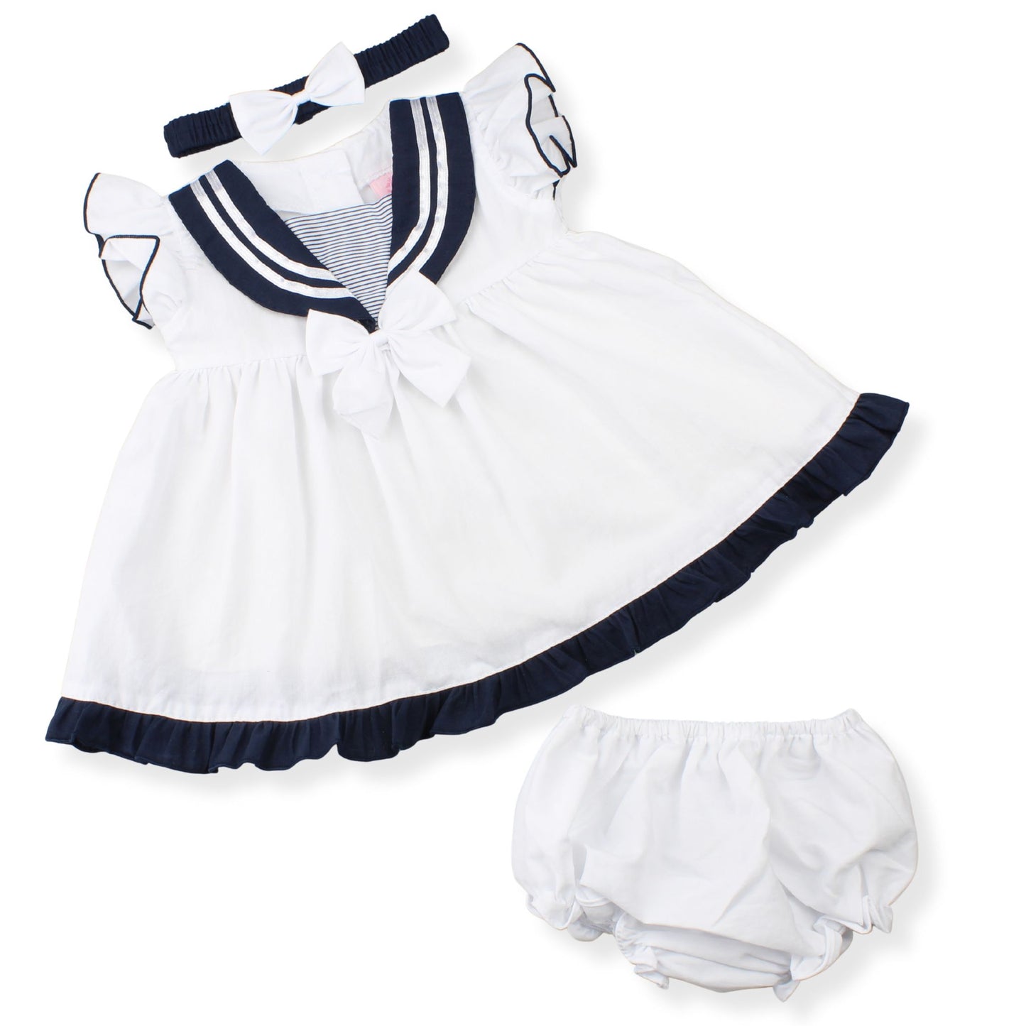 White dress with navy trim and matching bloomers on a white background