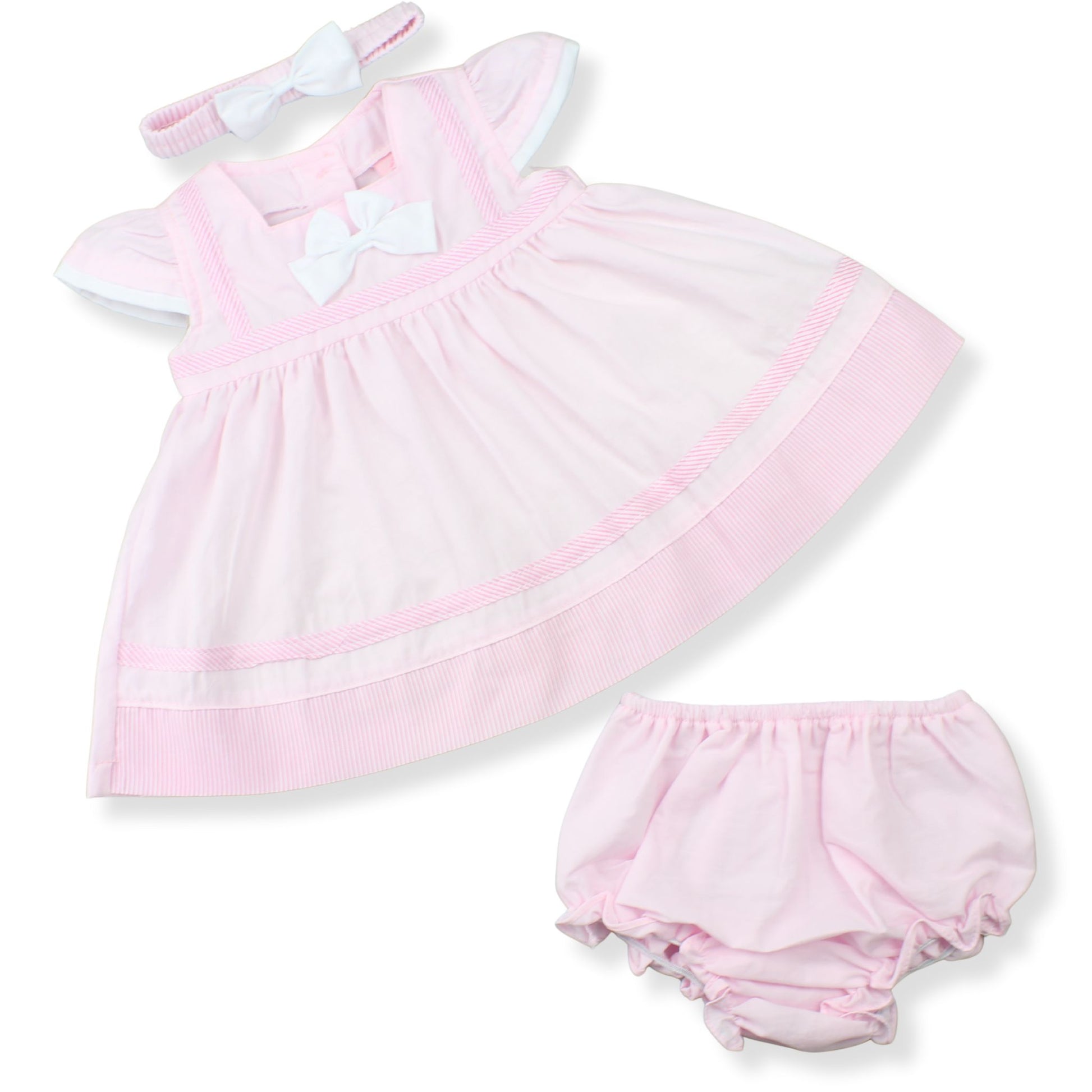 Pink baby dress with matching bloomers on a white background