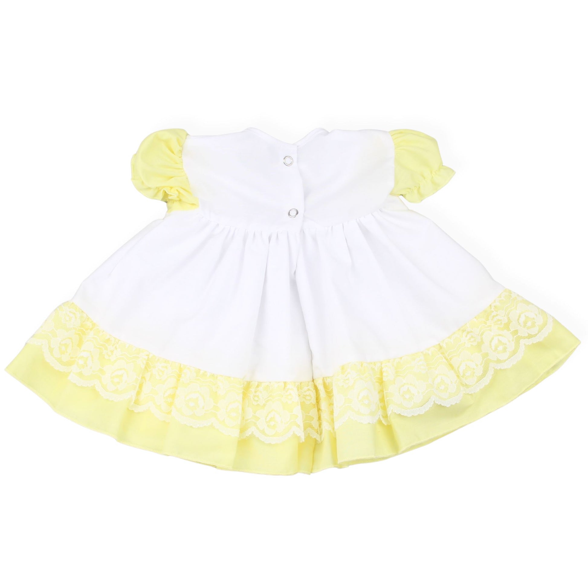 White dress with yellow trim and sleeves on a white background