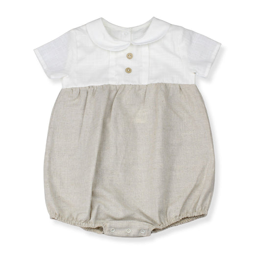Baby romper with white top and beige bottom on a white background