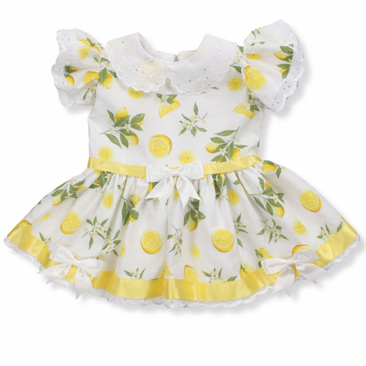 Children's dress with lemon pattern on a white background