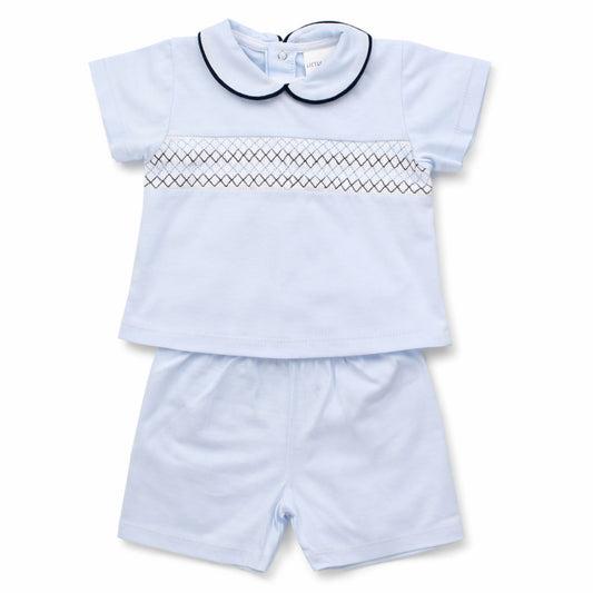 Light blue children's outfit with a short-sleeve top and shorts on a white background