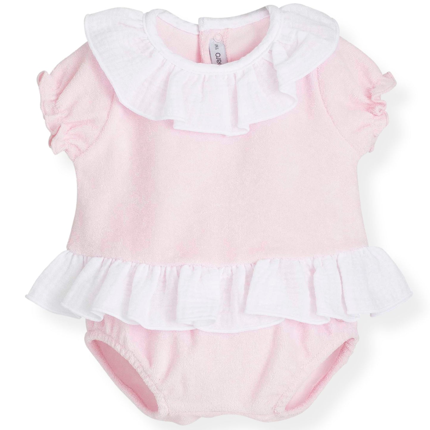 Pink baby romper with white ruffled collar and bottom on a white background
