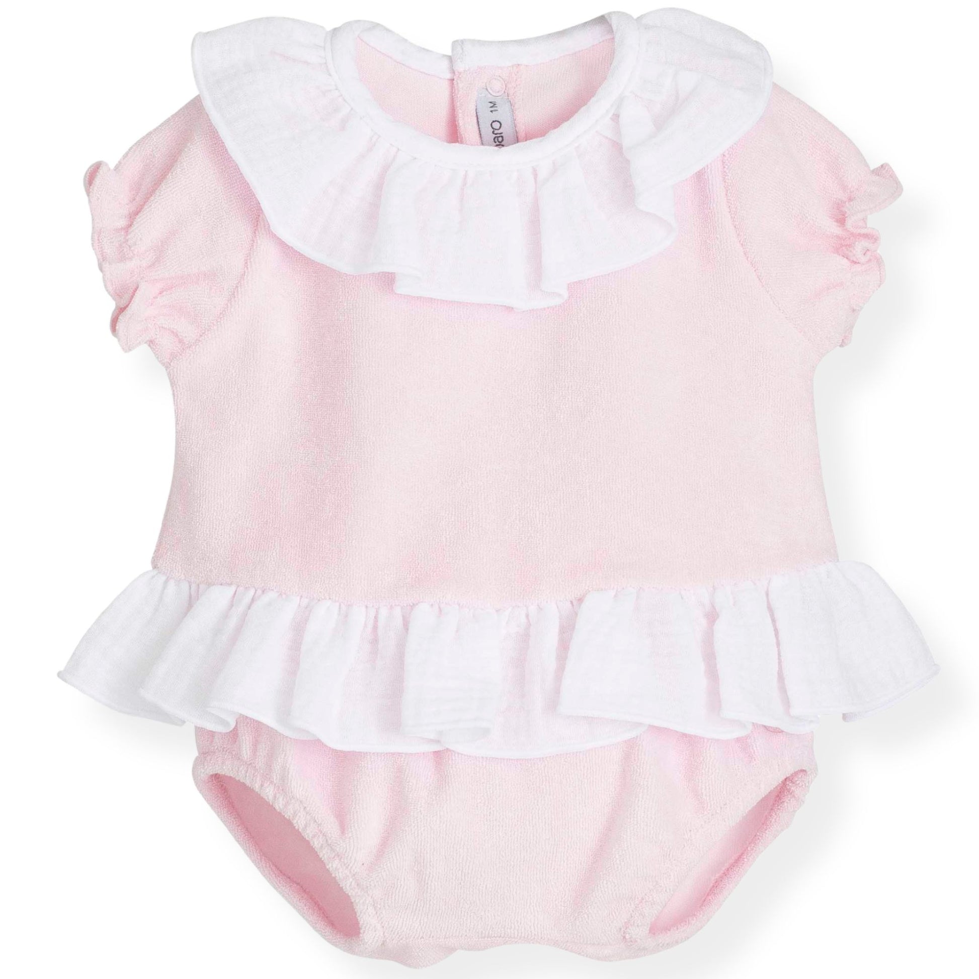 Pink baby romper with white ruffled collar and bottom on a white background
