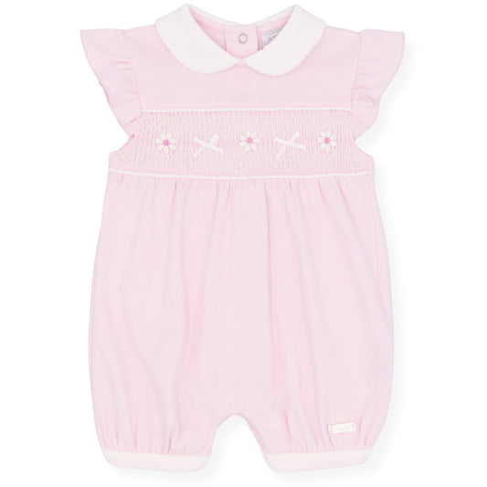 Pink baby romper with white collar on a white background