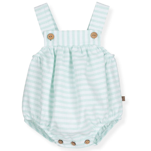 Striped baby romper with suspenders on a white background