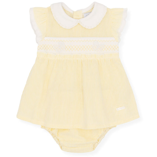 Yellow baby romper with white collar on a white background