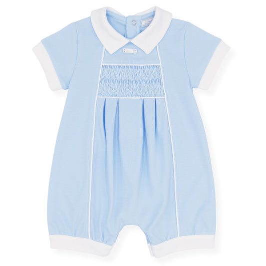 Light blue baby romper with white collar and cuffs on a white background