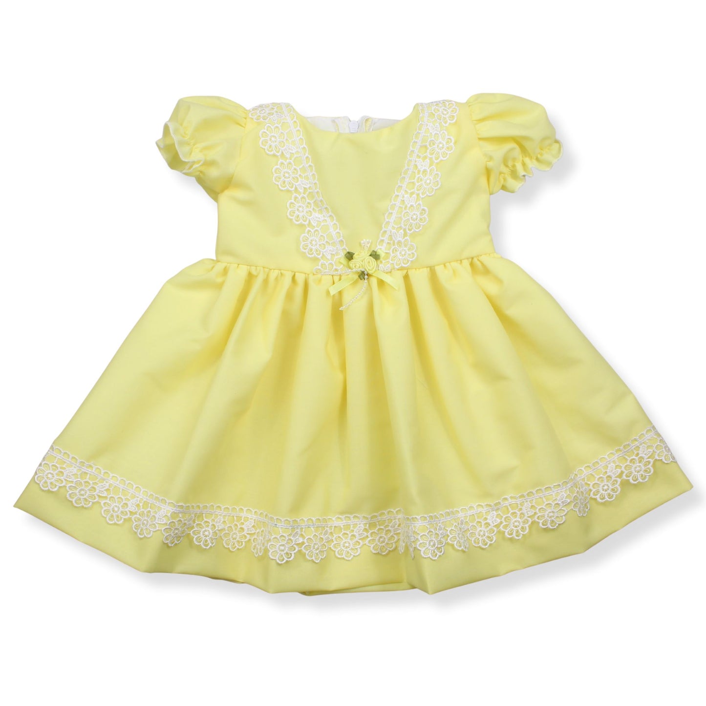 Yellow dress with lace details on a white background