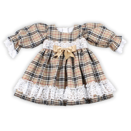 Plaid dress with lace details and a bow on a white background