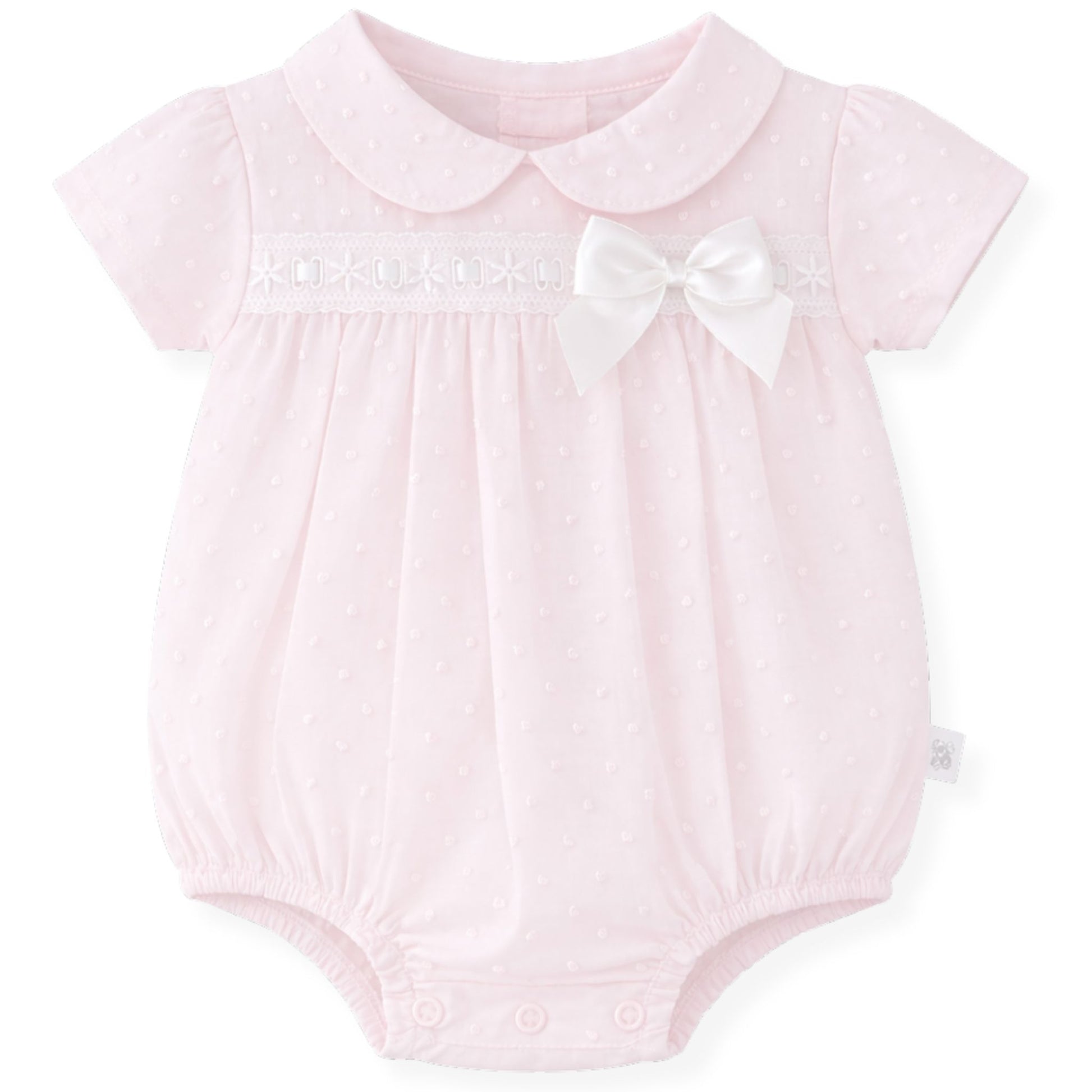 Pink baby romper with a white collar and bow on a white background