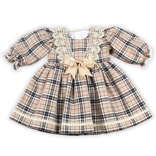 Plaid dress with lace details and a bow on a white background