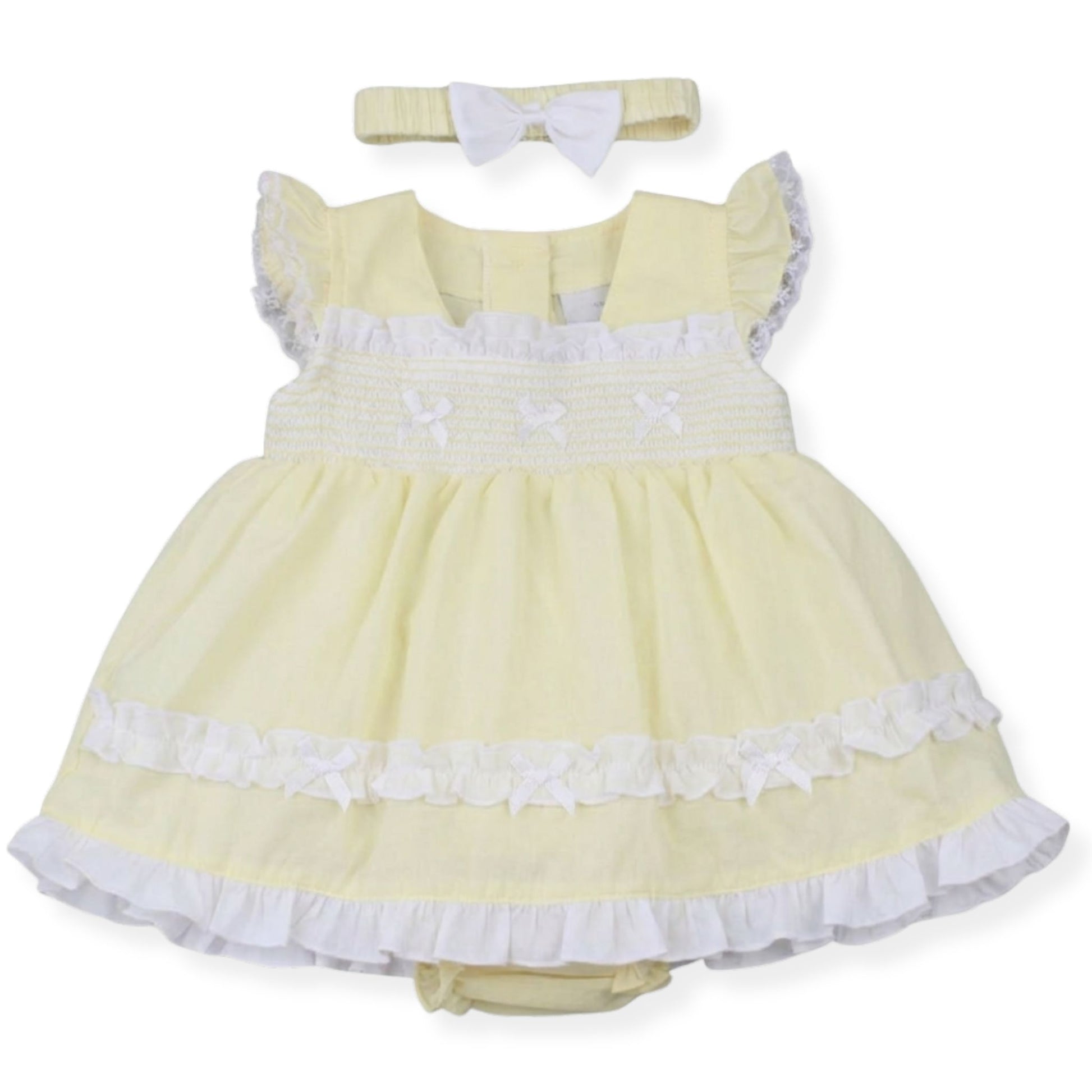 Yellow dress with white trim and matching headband on a white background
