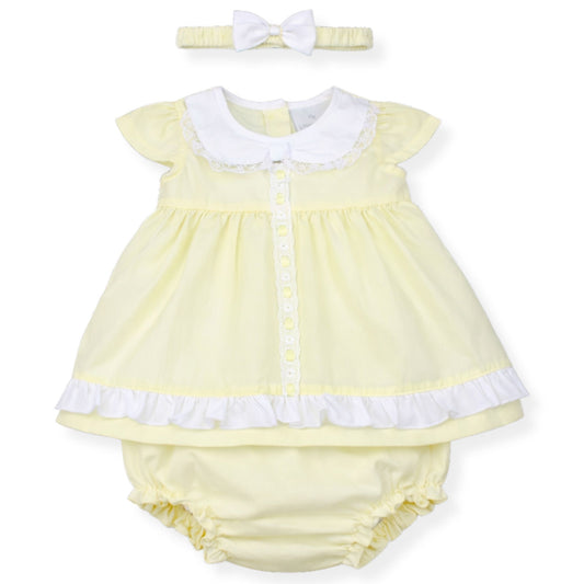 Yellow baby dress with white collar and matching headband on a white background