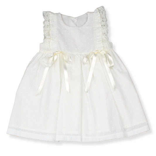 White dress with lace details on a white background