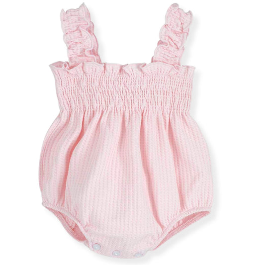 Pink baby romper with ruffled straps on a white background