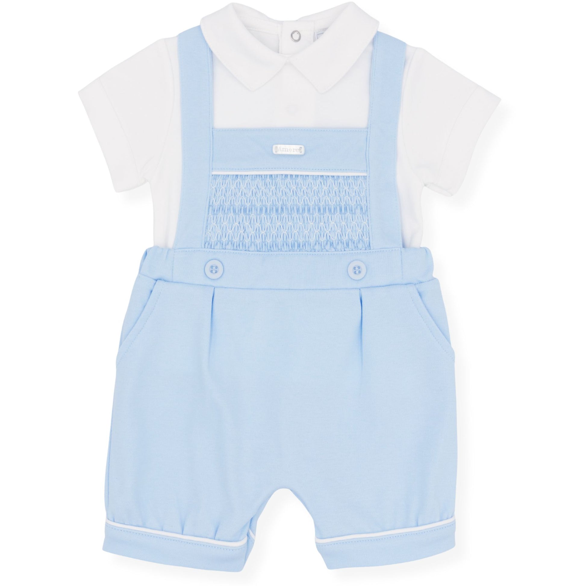Baby outfit with light blue smocked romper and white shirt on a white background