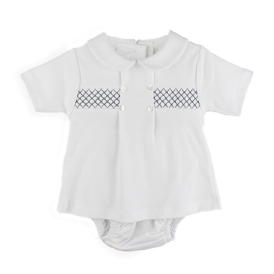 White baby two piece with navty smocking patterns on a white background