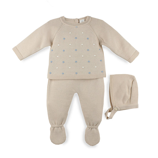 Baby knitted outfit set with long-sleeve top, footed pants, and hat on a white background