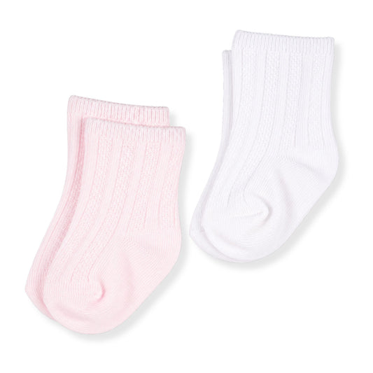 Two pairs of baby socks, one pink and one white, on a light gray background.