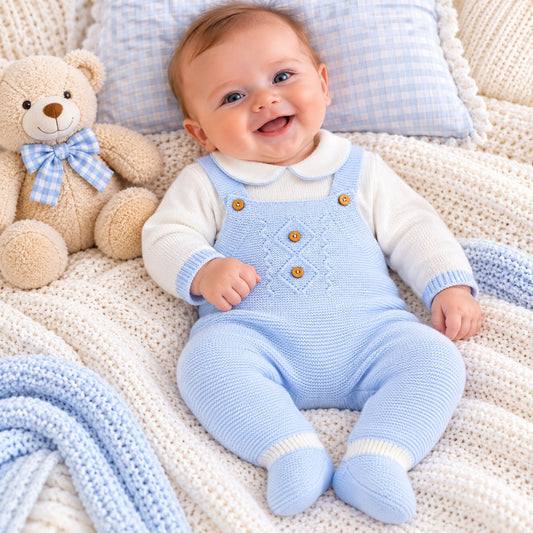 baby boy in blue knitted dungarees and matching top by dandelion