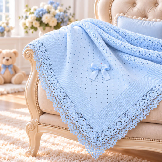 blue knitted baby shawl with bow and lace