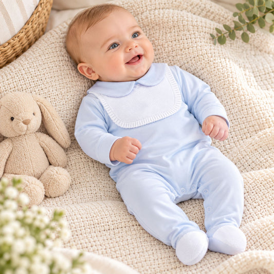 baby boy blue cotton sleepsuit with white bib