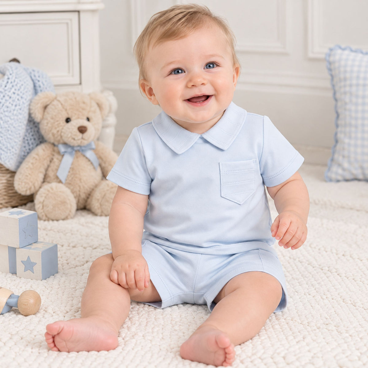 baby boy in blue two piece outfit