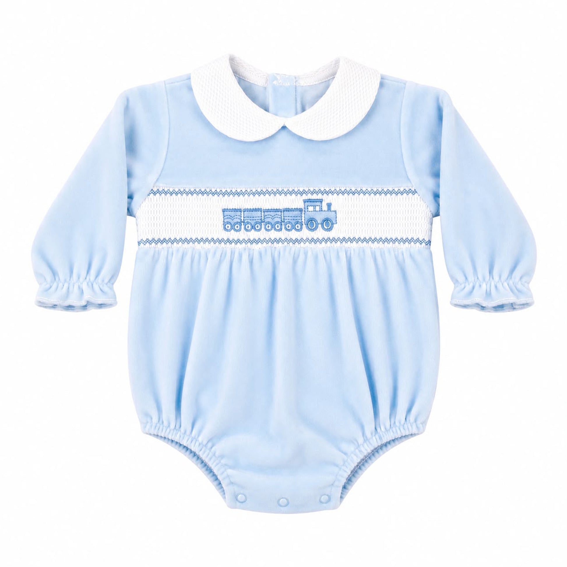 A baby long-sleeve bodysuit in light blue with a white Peter Pan collar, featuring a smocked horizontal stripe across the chest with a blue train motif.