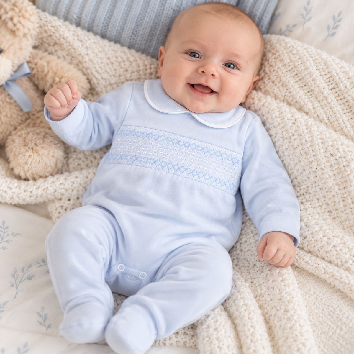 baby boy blue sleepsuit with smocking