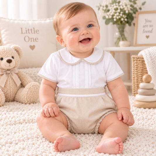 baby boy in beige smart shorts and white shirt