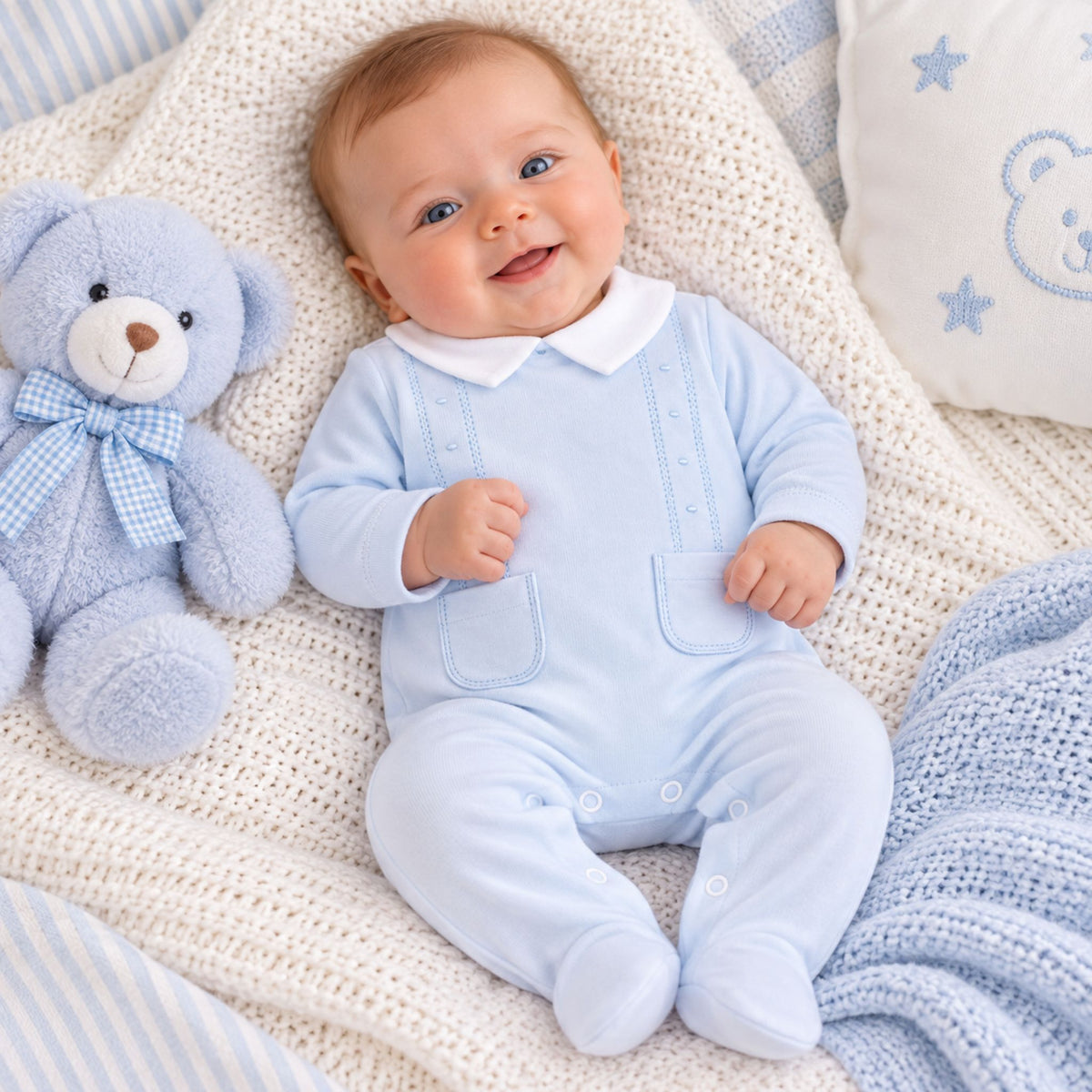 baby boy in blue cotton babygrow