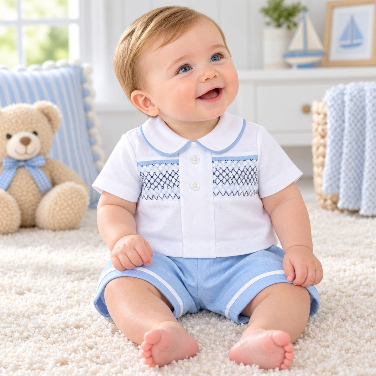 baby boy in blue shits with coordinating white shirt with smocking